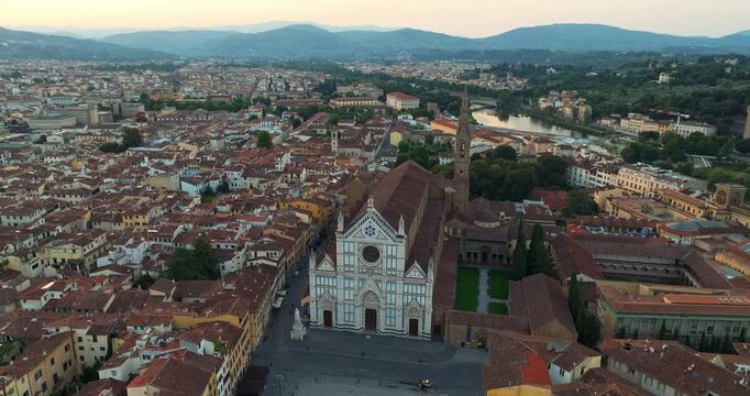 Basilica di Santa Croce Florence Italy drone view at sunrise. Magnificent Gothic architecture and historic city center streets captured during summer travel. Iconic tourism landmark