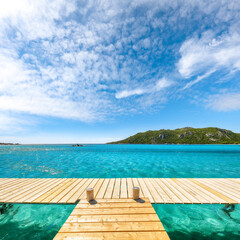 Fototapeta premium Breathtaking landscape with wooden pier on Santa Giulia beach.