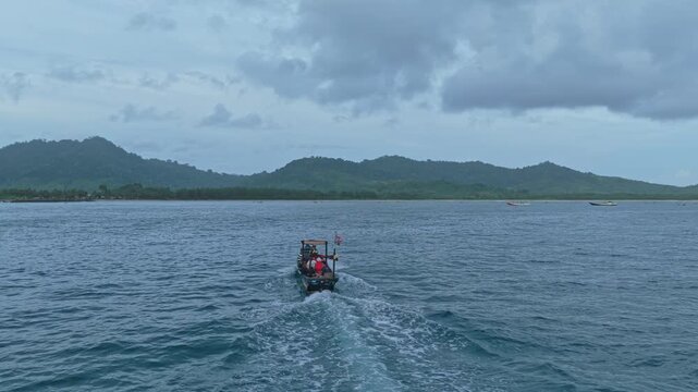 Traditional indonesian fishing boat sailing on the java sea