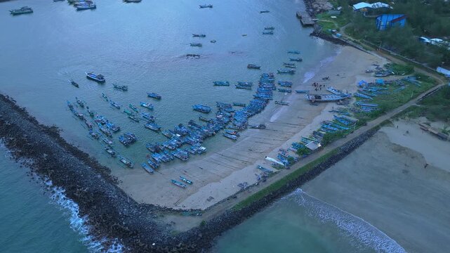 Aerial view of fishing boats moored at red island beach java