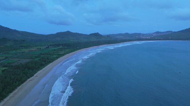 Aerial view of red island beach in java indonesia at dusk