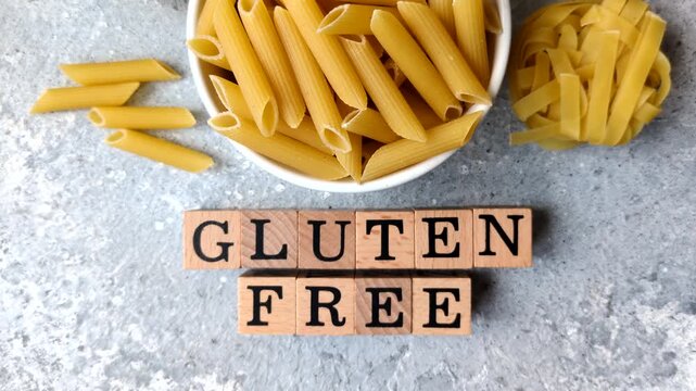 Italian uncooked, dry, gluten free penne regate pasta, ready for cooking. Dry, gluten free penne pasta as a food background for your design