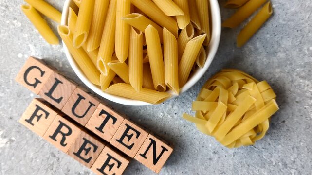 Italian uncooked, dry, gluten free penne regate pasta, ready for cooking. Dry, gluten free penne pasta as a food background for your design