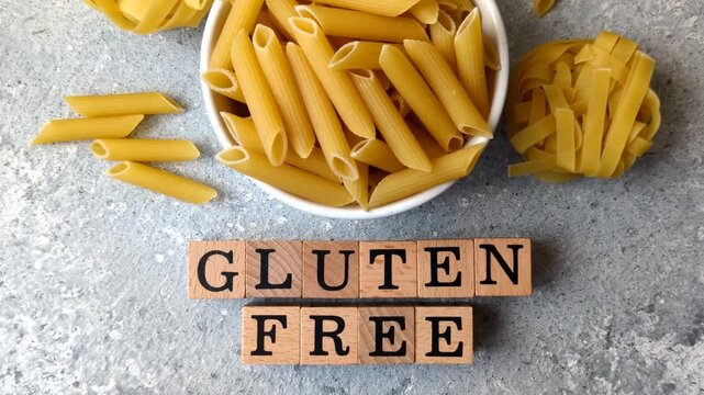Italian uncooked, dry, gluten free penne regate pasta, ready for cooking. Dry, gluten free penne pasta as a food background for your design