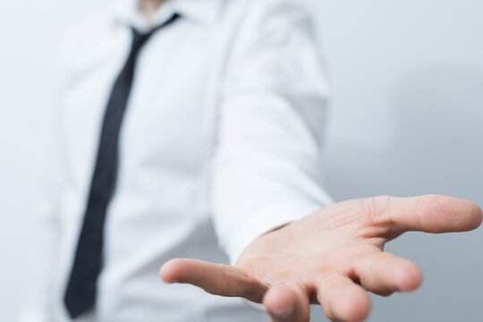 Business professional offering assistance or asking for help in gesture