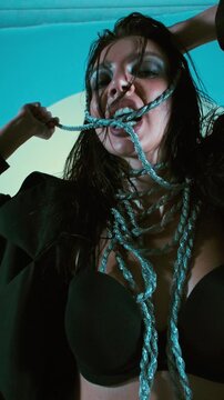 Close-Up Model in Black Lingerie and Leather Coat with Rope, Sunglasses