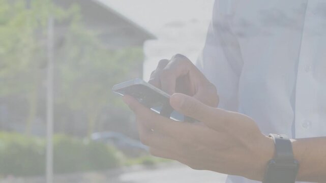 Man securing smartphone, tapping and swiping screen, adjusting grip while testing mobile app UI
