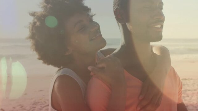 Travel marketing featuring woman stepping closer and embracing man on beach, expressing affection