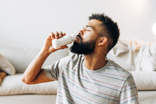 Man drinking probiotic yogurt for healthy lifestyle
