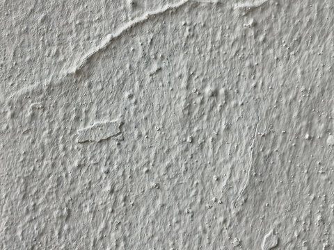 Textura de muro con estuco gris claro y relieve rugoso con sutiles imperfecciones