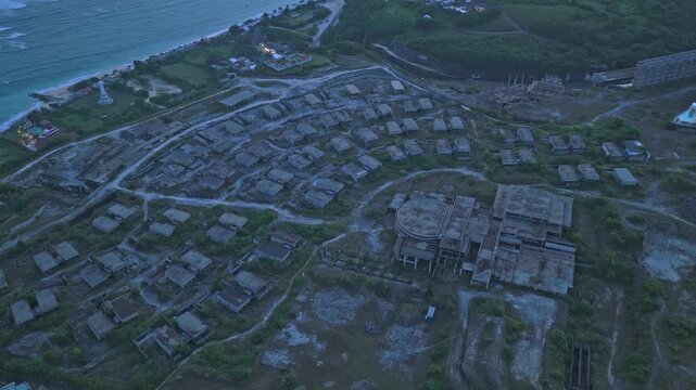 Abandoned hotel construction site by the ocean in bali