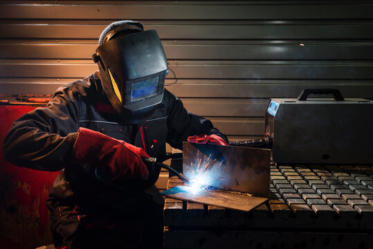 Crafting metal sparks in the evening workshop
