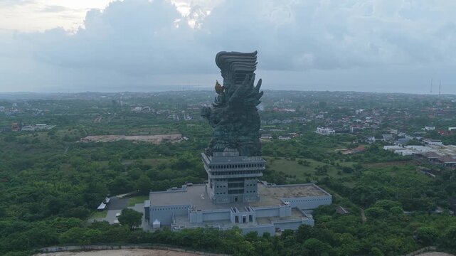 Aerial drone flying towards garuda wisnu kencana statue in bali