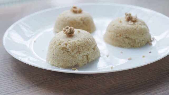 Close-up of traditional Turkish semolina halva with hazelnuts