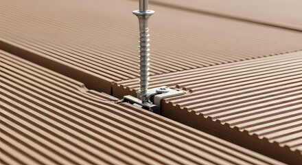 Fototapeta premium Close-up of a screw fixing two wooden deck planks