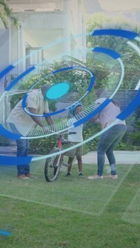 Vertical video: Kid entering, parents steadying bike fitting helmet for ride, spiral showing health