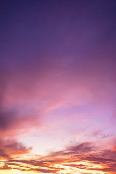 Beautiful purple and pink sunset sky with orange horizon clouds background,Majestic Pastel Sunset Sky with Vibrant Pink and Purple Cloudscape