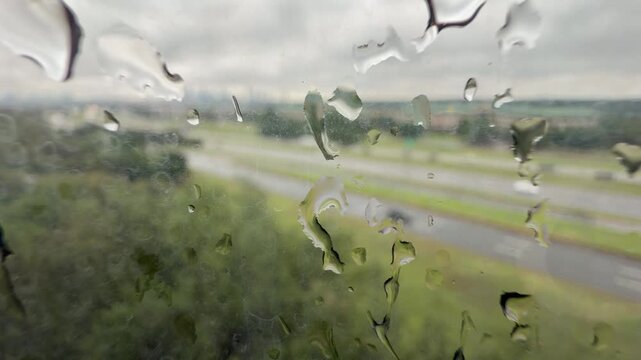 Traffic with raindrop reflection n window 