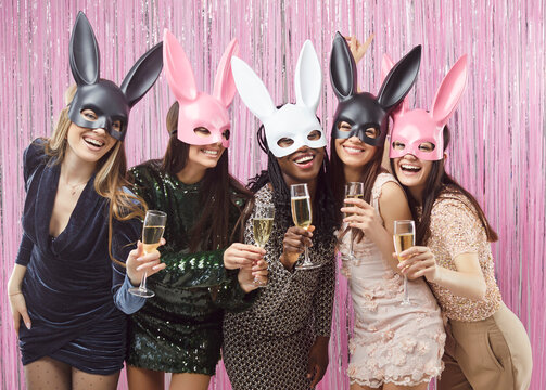 Happy multiracial friends girls fun wearing cute bunny rabbit mask, sexy women at club, diverse female laughing celebrate entertainment wedding gathering hen party, bachelorette party hen night, event