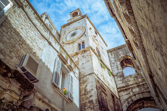Split, Croatia: Old stone building with clock tower and blue sky