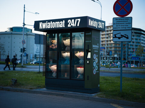 Wroclaw, Poland, 24th April 2026, shop sign and branding for a Kwiatomat automated flower bouquet dispensing machine