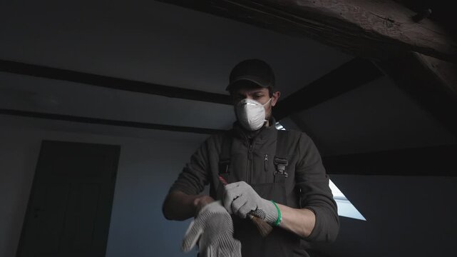 Putting on gloves befor painting, medium shot