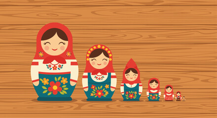 Obraz premium Set of traditional Russian Matryoshka nesting dolls in varying sizes is lined up against a natural wooden background.