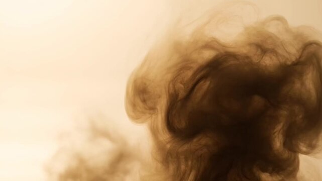 Smoke rising in the air slowly.