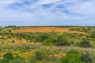 Fototapeta premium Rolling countryside fields under dramatic Algarve summer skies