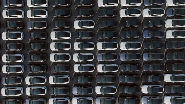 Aerial view car for sale stock lot row, Cars dealership inventory distribution automobile and automotive business.	
