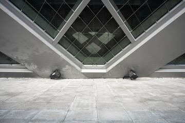 Modern architectural glass dome structure viewed from ground level with geometric metal framing and concrete flooring © zhu difeng