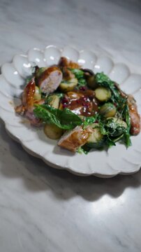 Gourmet Roasted Quail with Potatoes and Sauteed Greens. Perfect for fine dining and culinary marketing