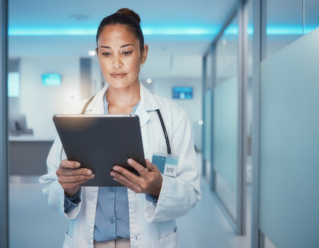Young Young Female Doctor Female Doctor Using Using Tablet Tablet in Modern Clinic Modern Clinic