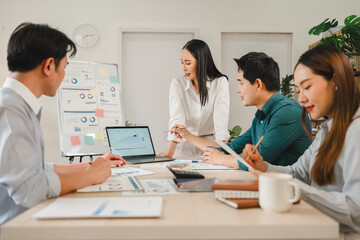 Fototapeta premium A team of diverse business professionals discussing data strategy during a collaborative office meeting