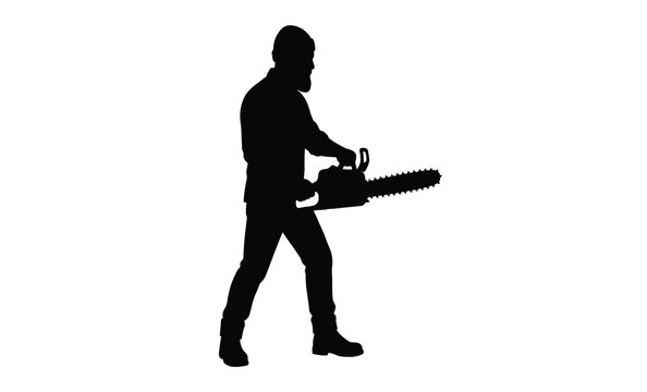 A lumberjack powerfully operates a chainsaw captured in dramatic black form silhouette