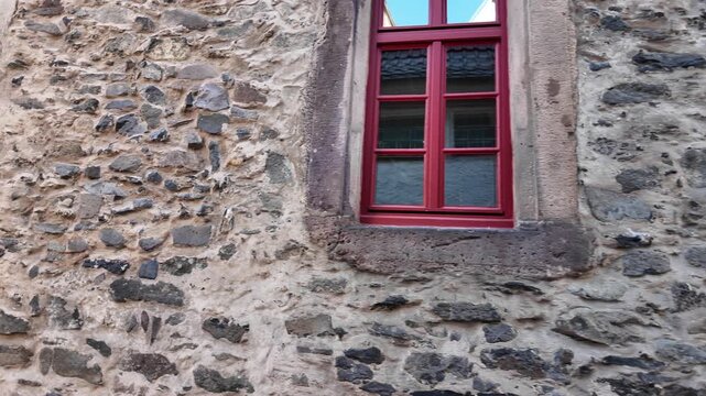 Cinematic Slow Motion Detail Of Red Window Frames In An Ancient Stone Building