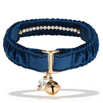 Elegant blue velvet choker with gold charm and crystal isolated on white background