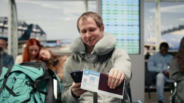Waiting for plane arrival, boarding pass and man in airport checking flight itinerary on smartphone. Doing trip planning, passport document and passenger using phone, camera A