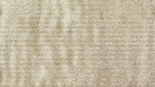 Abstract light brown background with grainy texture. Wavy surface with horizontal striped effect.