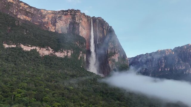 Aerial drone shot of Angel Falls in Canaima, Venezuela, right to left pan showing the majestic waterfall and lush jungle landscape, 4K