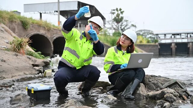 Environmental Inspection Team Sampling Water for Pollution Analysis