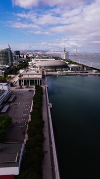 Aerial view of Altice Arena and Parque das Nacoes skyline on a cloudy day. Lisbon, Portugal