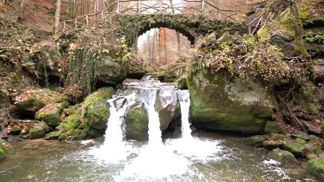 deep in the forest there is a small waterfall in switzerland in Luxembourg