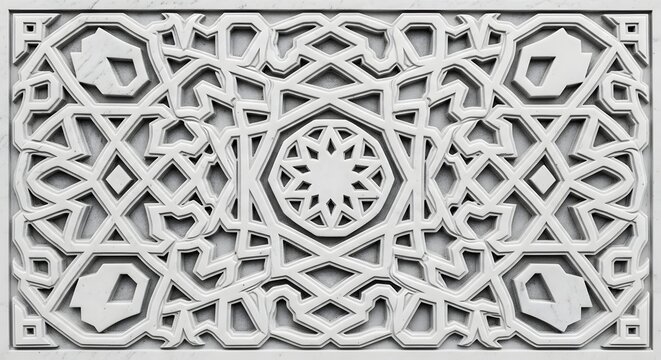 White relief carving of complex geometric islamic pattern with bas relief