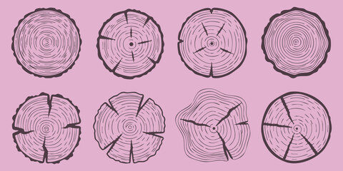Set of pink tree trunk cross section icons showing wood grain rings and cracks in a flat minimalist vector style © GraphixEra