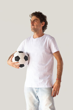 Man with a soccer ball and a white t-shirt with space to write