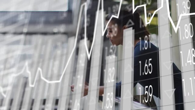 Woman leaning atrium railing tapping phone causing finance charts or bars rising while tracking fund