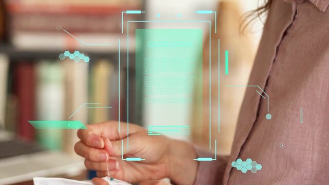 Woman pinching fabric and stitching elastic at table, HUD showing stitches while inspecting craft