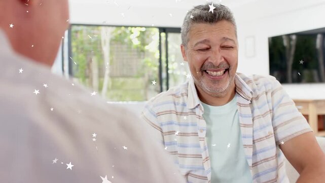Right man reaching forward, two men clasping into arm-grip, sparkles overlaying playful marketing