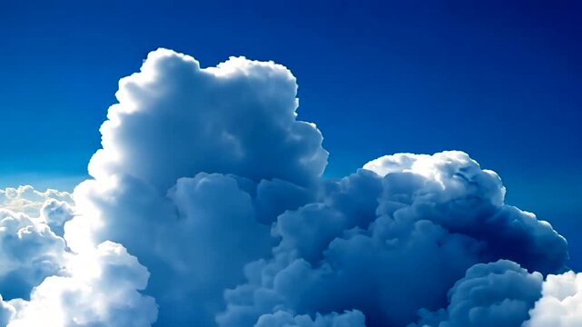 A vibrant, aerial image showcasing fluffy white cumulus clouds against a bright blue sky